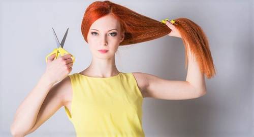 Red Head Woman with long hair and scissors