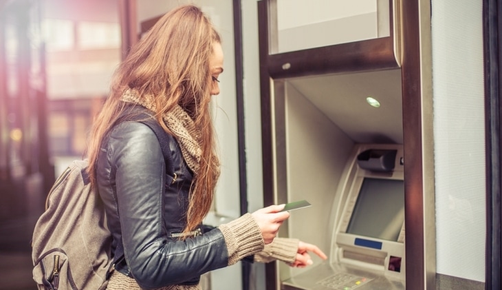 Student withdrawing cash from an ATM