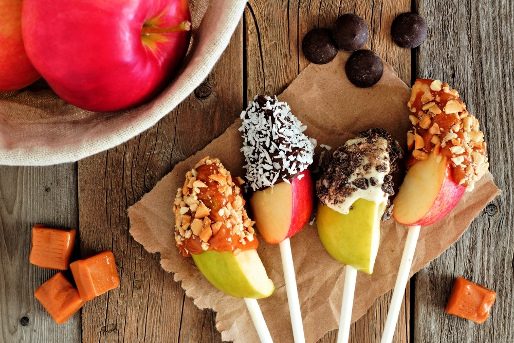 Apple lollypops dipped in chocolate and caramel