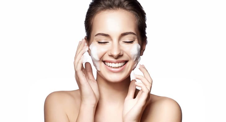 Woman applying beauty treatment to skin