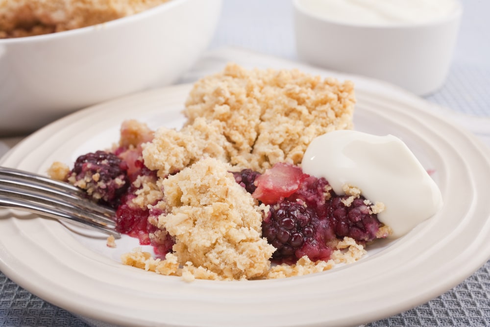 Blackberry and apple crumble on a plate