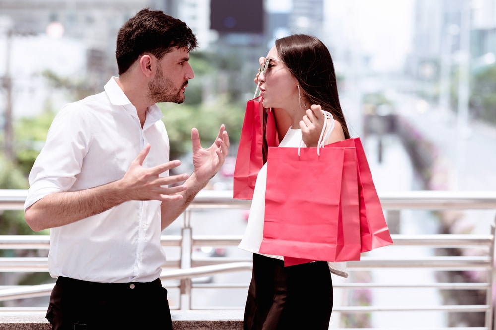 Couple arguing about one of them shopping too much