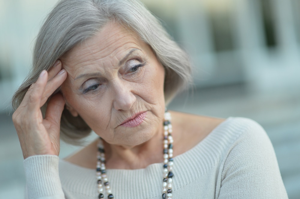 Elderly woman thinking