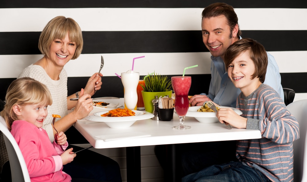 Happy family having a meal in a restaurant