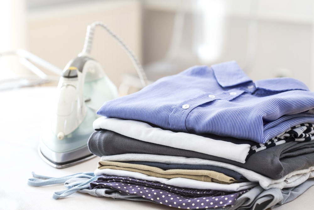 Folded clothes on ironing board