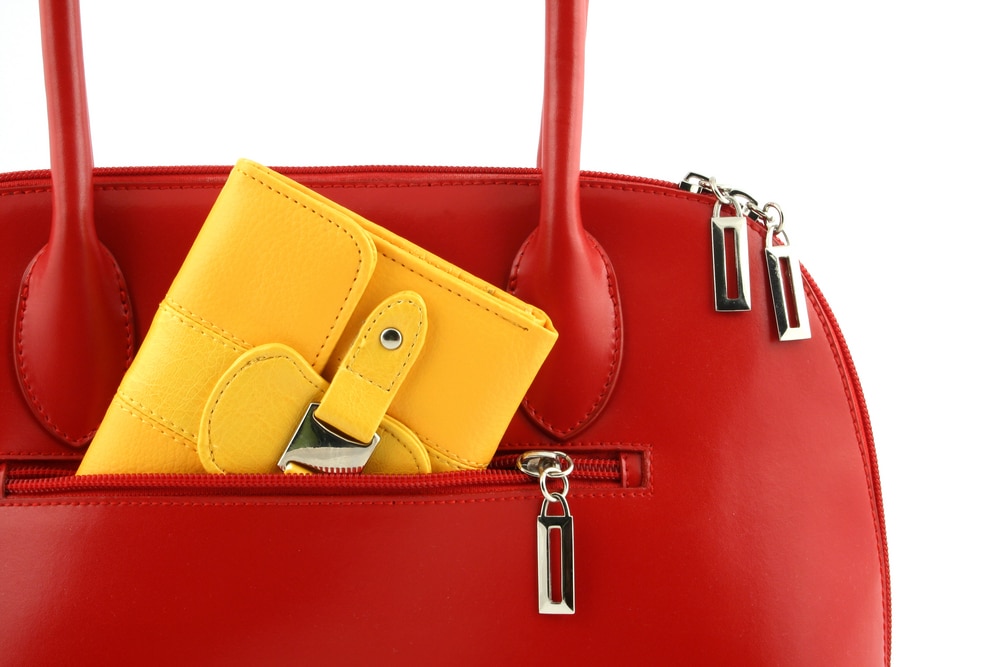 Red handbag with yellow purse in