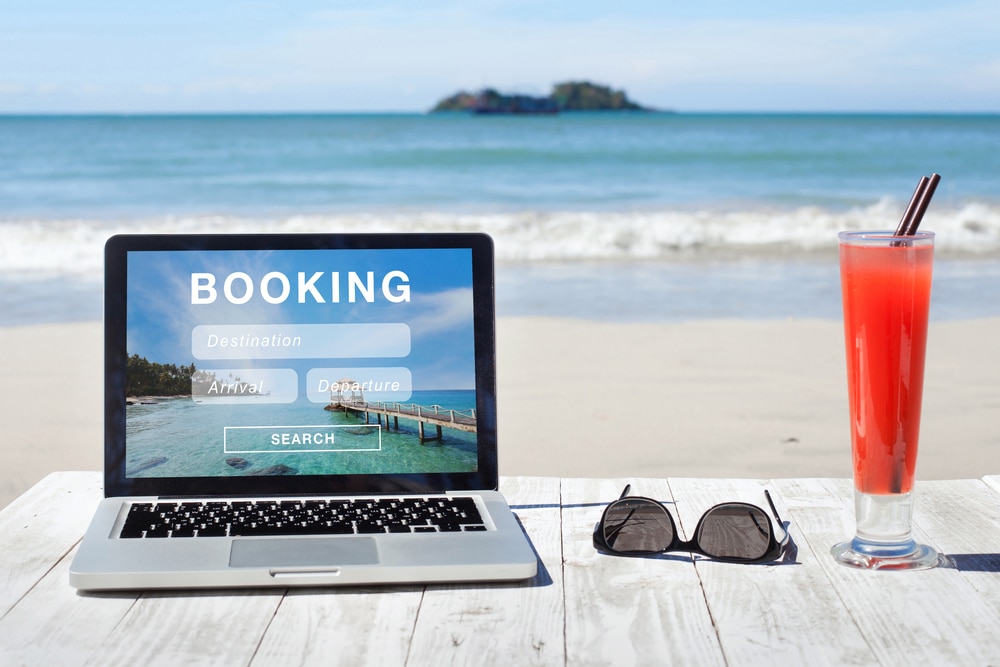 Holiday booking website on laptop