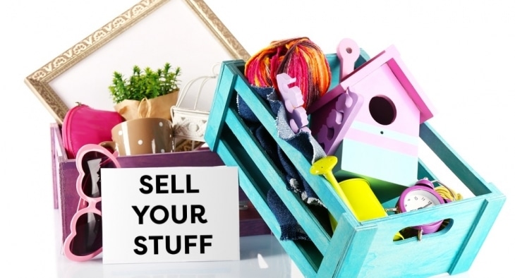 Crates full of items and "Stuff To Sell" sign