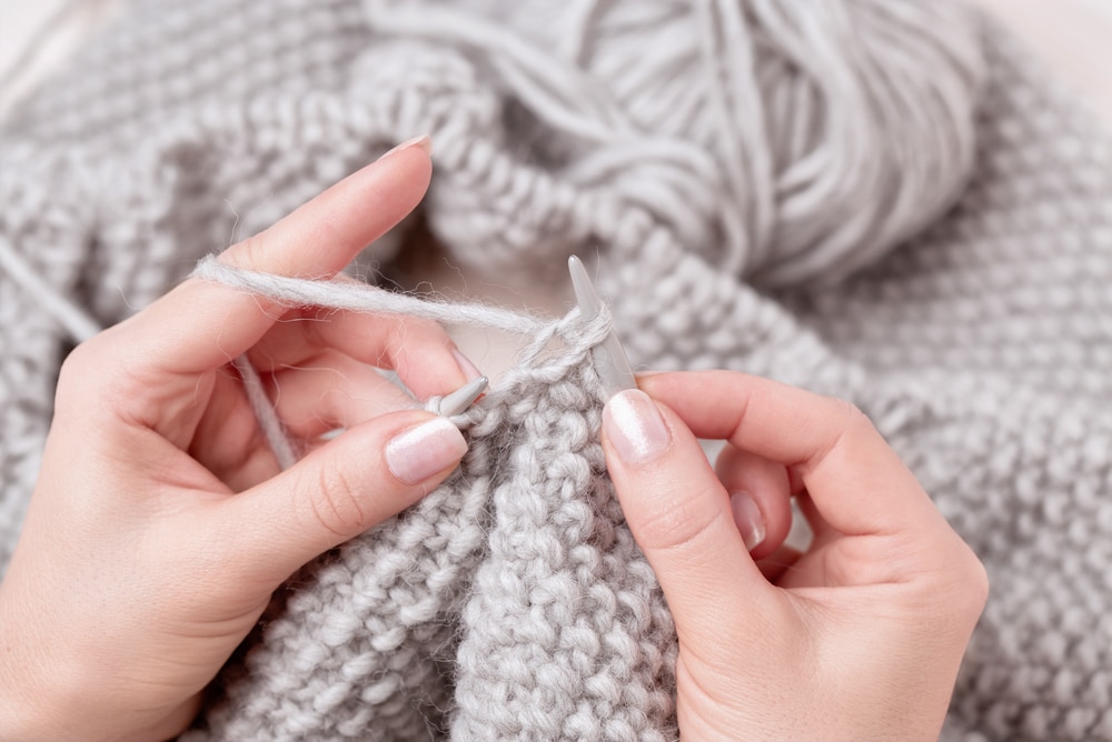 Womans hands knitting