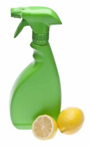 Unbranded spray bottle and fresh lemon halves