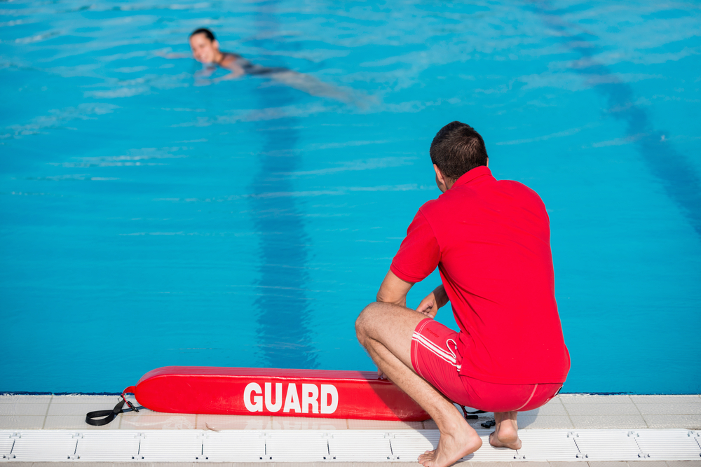 Lifeguard by a swimming pool