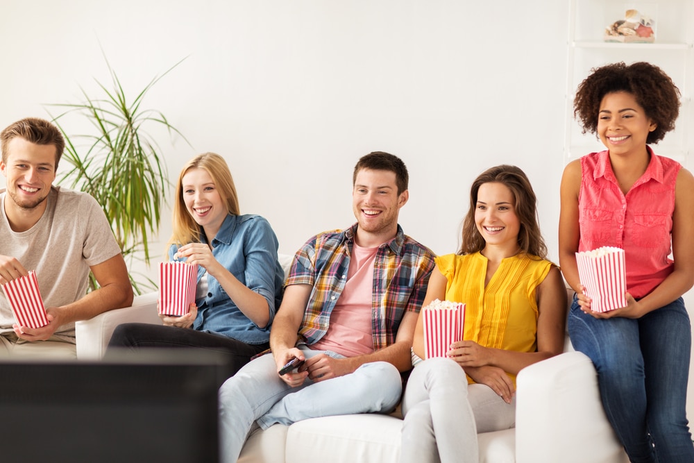 Group watching film at home