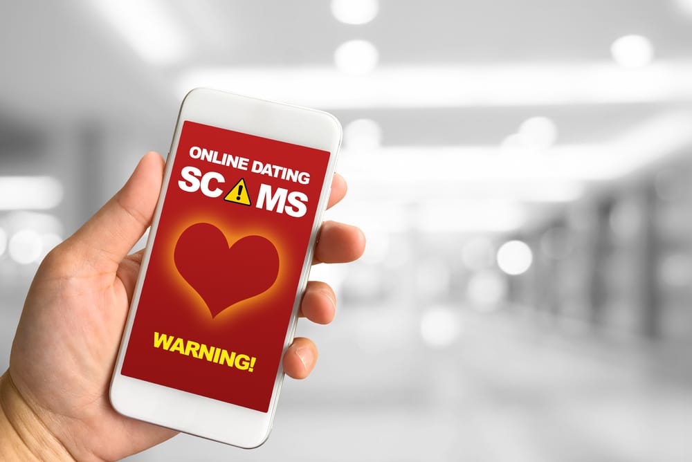 Online dating scam warning on phone