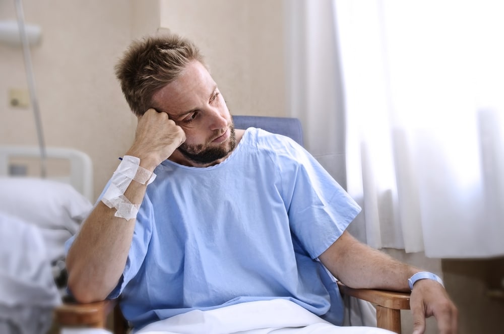 Unhappy man such in hospital