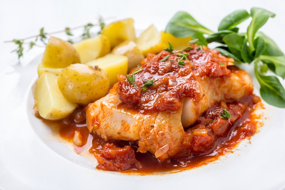 White fish with tomato anchovy sauce