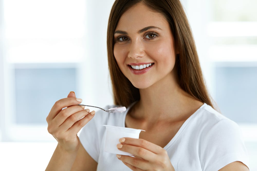Woman eating Yogurt