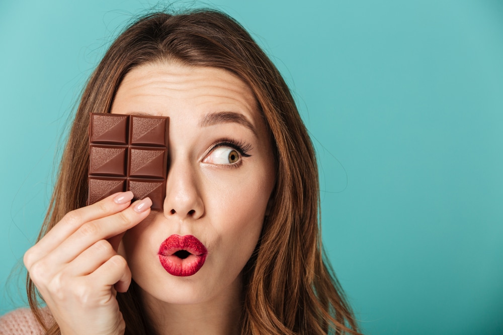 Silly woman holding chocolate