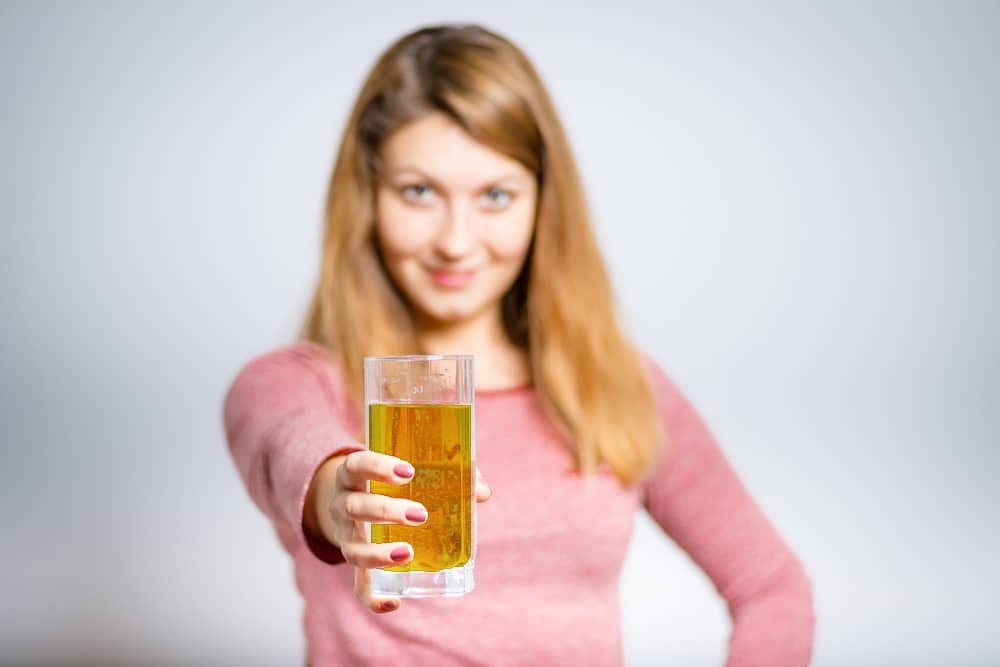 Woman offering a beer