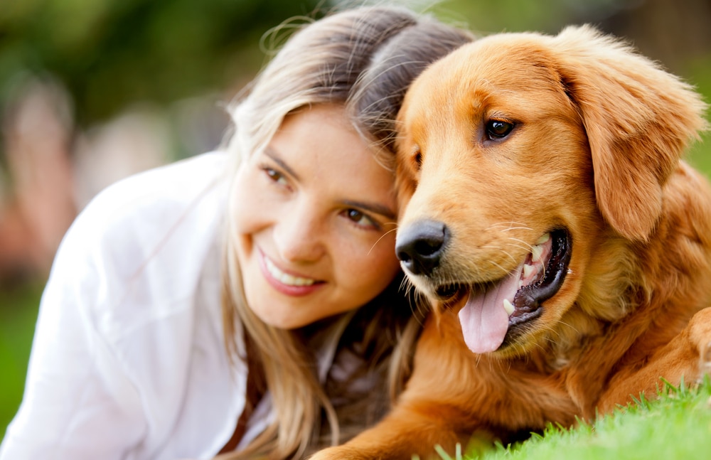 Woman with her golden retriever