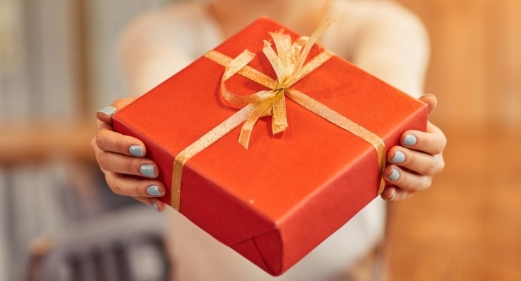 Woman holding gift box