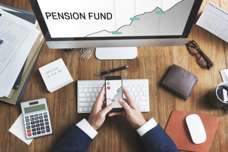 calculator and phone looking at drawdown pension fund