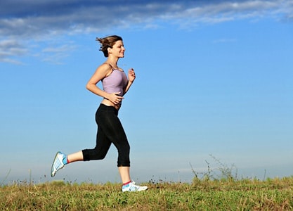Young woman running outdoor.